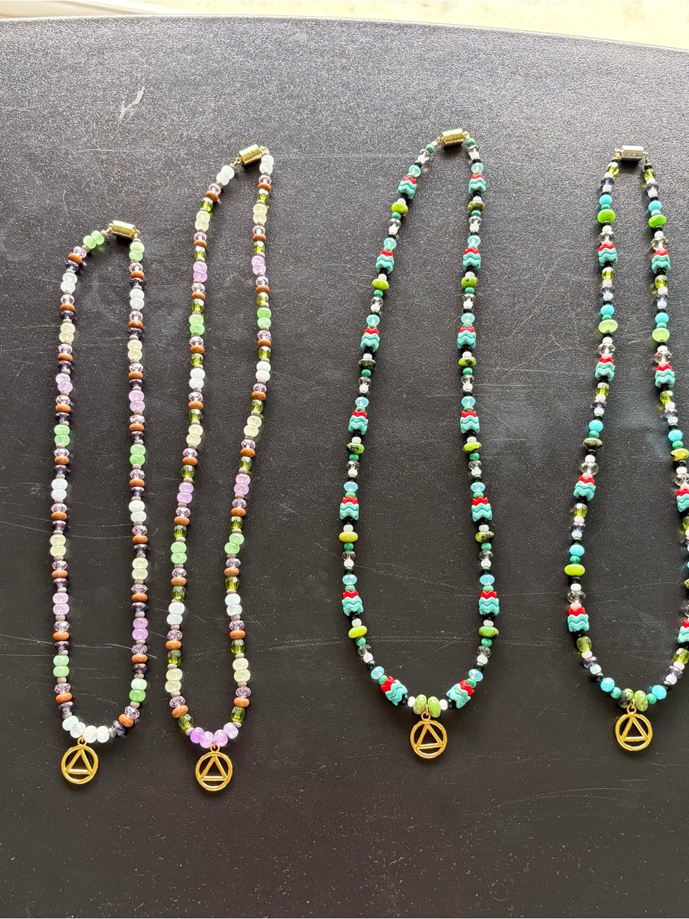 Handmade Multicolor Beaded Necklace with Gold Triangle Charm - Green Accent